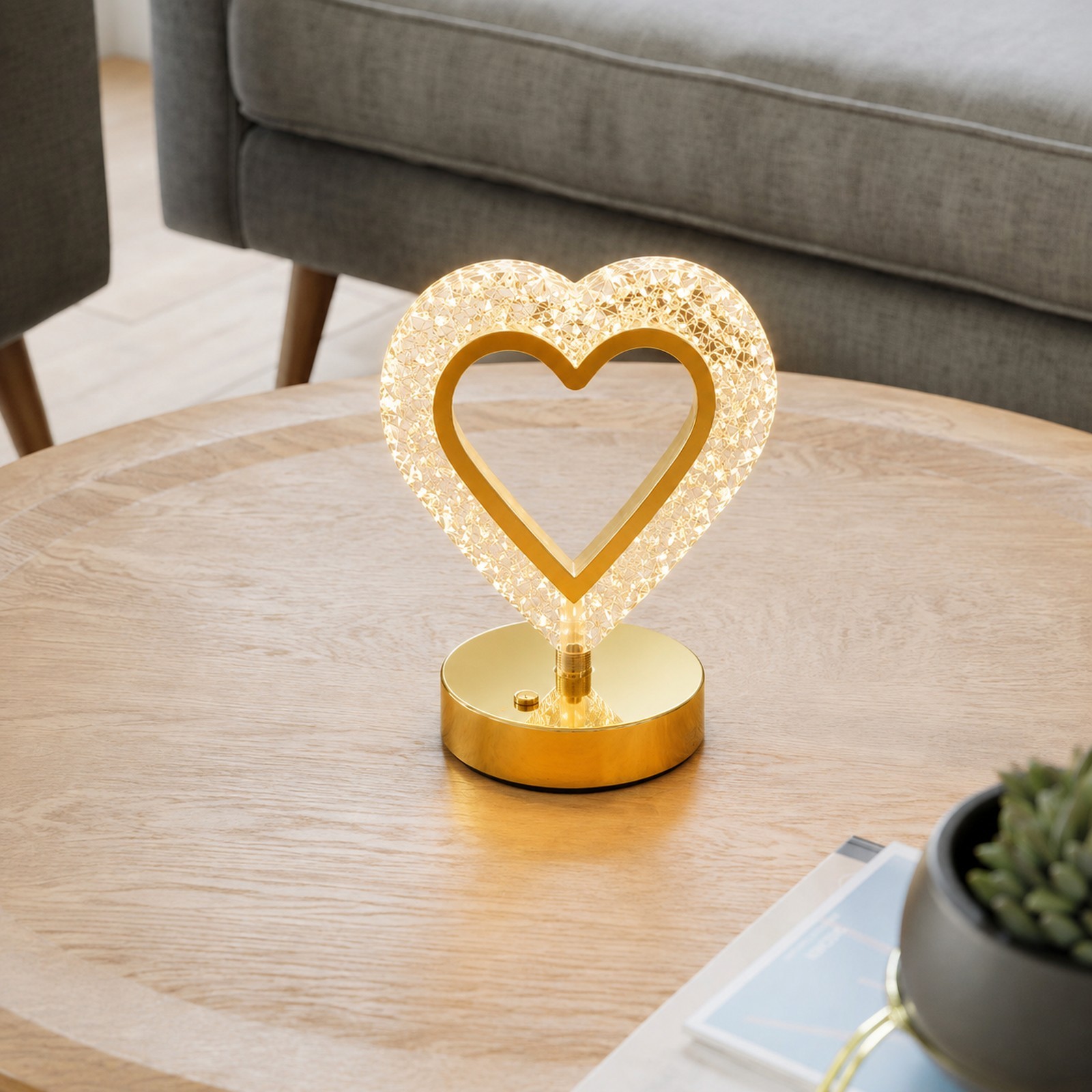 Neat Living crystal heart lamp on a coffee table